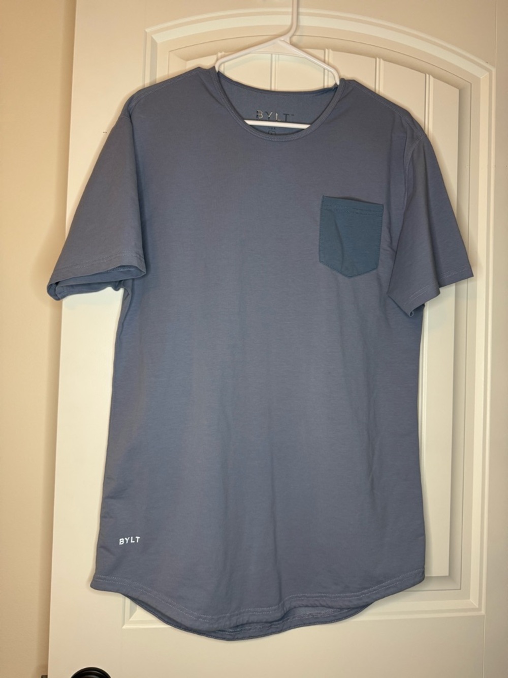 2 BYLT Basics Men's Short Sleeve Pocket Tee in Blue and another in Black.